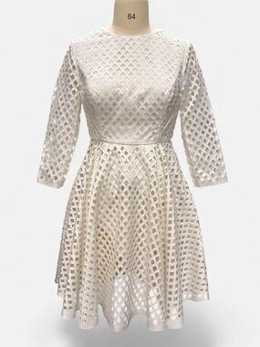 White dress with diamond-shaped cut-out pattern